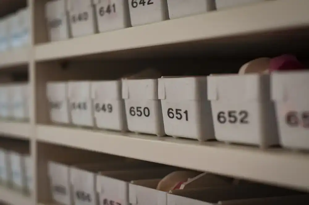 A wide view of the puzzle library shelves filled with colourful jigsaw boxes